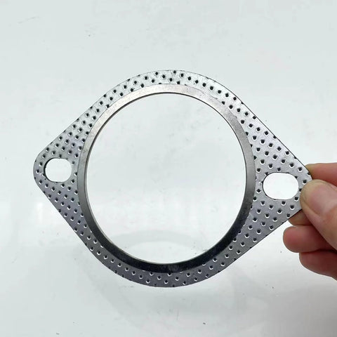 Close-up of a 3 inch exhaust gasket with perforated metal flange and two bolt holes for 3 inch muffler flange manifold