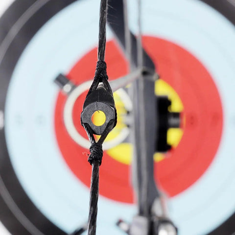 Lightweight Rubber Peephole Tube Replacement for Compound Bow String Systems attached to bowstring with target background