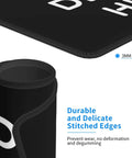 Close-up of custom photo mouse pad with durable anti-fray stitch edge, rolled view, for home office use, 7.9 by 9.5 inches.