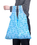 Person holding blue star-patterned Foldable Reusable Grocery Tote Bags Six Pack for Easy Shopping and Travel Totally Lightweight 190T Polyester
