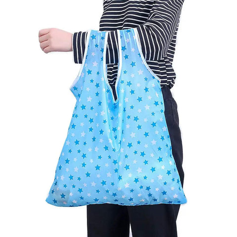 Person holding blue star-patterned Foldable Reusable Grocery Tote Bags Six Pack for Easy Shopping and Travel Totally Lightweight 190T Polyester