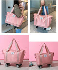 Expandable Travel Tote Bag with Trolley Sleeve and Wheels, Waterproof Oxford Duffel, Pink Duffle with Detachable Wheels Shown on Floor