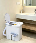 Hand Cranked Portable Washing Machine For Off Grid Camping And Rv Life Non Electric Manual Laundry Scrubber in a modern bathroom.