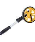 Measuring Wheel 0-9999.9m Digital Display for Construction Worker with yellow wheel and black grip handle.