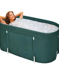 Woman relaxing in a Portable Foldable Bath Tub For Adults With Thick Insulation Foam Keeps Water Warm Oval Bath Tub For Showers Space Saving Indoor Outdoor Soaking Tub Easy Setup For Small Bathrooms At Home Or On The Go