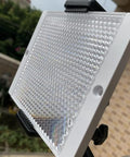 Close-up of Large 100 By 100 mm Plastic Reflector For Photoelectric Sensors with high definition transparent surface mounted outdoors.
