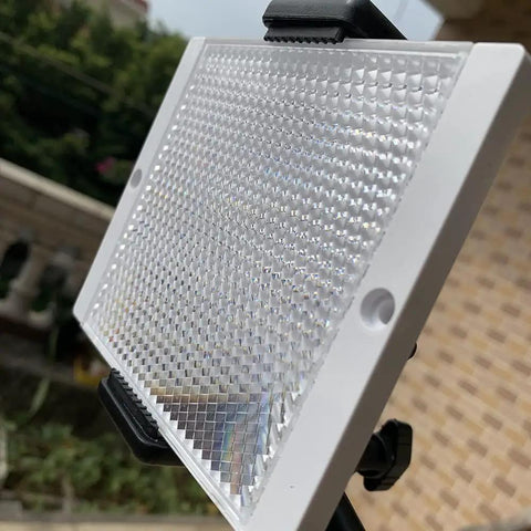 Close-up of Large 100 By 100 mm Plastic Reflector For Photoelectric Sensors with high definition transparent surface mounted outdoors.