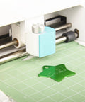 Pro Grade Premium Carbide Engraving Tool and Tip for Cricut Joy and Joy Xtra engraving a star-shaped green tag on a mat