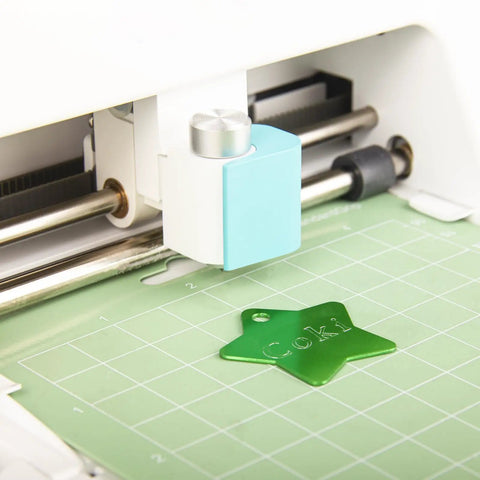 Pro Grade Premium Carbide Engraving Tool and Tip for Cricut Joy and Joy Xtra engraving a star-shaped green tag on a mat