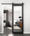 Black 32 Inch By 84 Inch Mirror Barn Door With Five Point Five Foot Sliding Hardware Kit Included No Assembly Required One Lite Full Length Solid Wood Waterproof PVC Surface installed in bathroom doorway