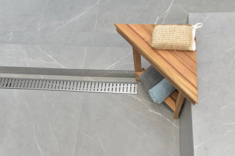 Fifty Nine Inch Brushed Nickel Linear Shower Drain Kit Crafted From Tough As Nails 304 Stainless Steel Featuring A Heavy Duty Long Hair Catcher Strainer For Smooth Tile Bathroom Remodels near wooden towel rack