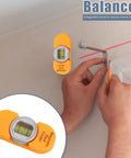 Portable Screw Finder Magnetic Detector for Wood and Metal Studs used to find balance on a wall with a level bubble.
