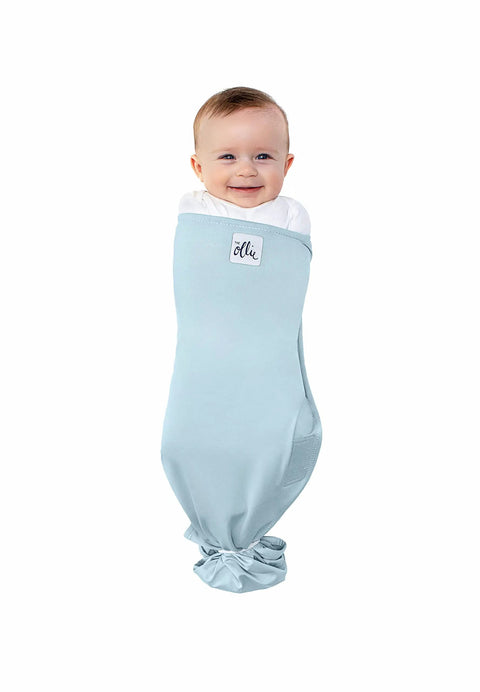 Adjustable Baby Swaddle For Newborns That Feels Like The Womb Pediatrician Recommended Safe Sleep Solution in Sky color with baby inside