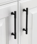 Matte Black Cabinet Pulls 5 Inch Center To Center Zinc Alloy Kitchen Cabinet Handles 10 Pack installed on white cabinet doors