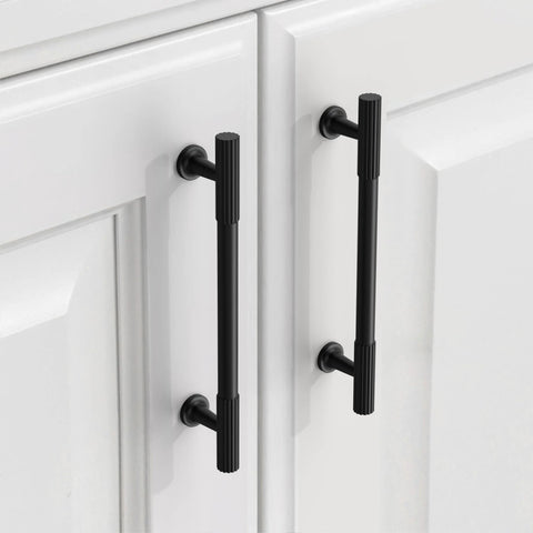 Matte Black Cabinet Pulls 5 Inch Center To Center Zinc Alloy Kitchen Cabinet Handles 10 Pack installed on white cabinet doors