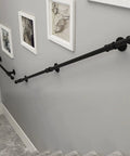 Heavy Duty Wrought Iron Handrail Rock Solid Built For Outdoor Stair Safety Sleek Matte Black rust resistant grab bar on a stairway.
