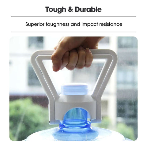 Person holding a durable water jug with strong handle, showcasing impact resistance, with a building exterior background