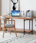 Beefy Industrial Pipe Desk Leg Set 28 Inch Heavy Duty Vintage Style Furniture Legs supporting wooden desk with laptop and books.