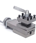 Mini metal lathe tool post assembly with square base and eight bolts side view