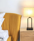 Must-Have Set Of 2 Modern Touch Lamps With Dual USB Ports And AC Outlet on a bedroom nightstand, cream shade glowing softly.
