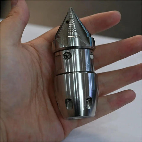 Hand holding Anti Corrosion Rotating Nozzle For High Pressure Water Jet Pipe Cleaning Tough Clog Buster Accessory For Sewer Machines Corrosion Resistant
