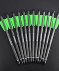 7.5 Inch Carbon Crossbow Bolts With 2 Inch Green Vanes And 100 Grain Removable Tips, Built For Outdoor Hunting And Target Practice, Durable Shaft, Low Hand Shock, Deadly Accurate, 12 Pack Arrows displayed on black surface.