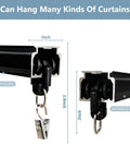 Close-up of black heavy duty ceiling curtain track system with clips, showing aluminum sliding rails and quiet pulleys.