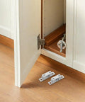 Solid Silver Copper Cabinet Door Rollers With Silent Close And Rust Resistant Finish, 10 Pack shown inside a cupboard.