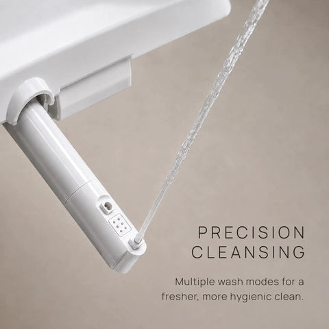 Slick Smart Bidet Toilet Seat With Heated Seat And Warm Water Spray Plus Air Dryer Remote Control showing precision cleansing nozzle.
