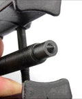 Close-up of Two Jaw Twin Leg Gear Puller Bearing Removal Tool Kit With Screw Lock And Adjustable Arms For 17-38mm Bearings.
