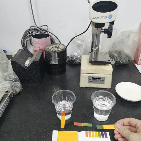 Person using PH Test Strips 20 Pack for Urine Saliva Drinking Water Pool Spa Soap Fish Tank And Liquids with color reference guide