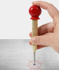 Heavy Duty Spring Loaded Center Punch With Protective Cap marking a precise spot on a metal surface for steel and timber projects.
