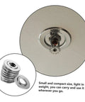 Close-up of a stainless steel fire sprinkler escutcheon plate mounted on a ceiling with decorative split trim ring.