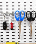 Two Pack Multi Prong Pegboard Accessories Organizer Kit With Tool Storage Hooks holding scissors and keys on white pegboard.