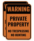 Two Pack 14 By 10 Inch Heavy Duty Aluminum No Trespassing And No Hunting Signs Private Property Warning Plaques on orange background.
