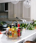Two Pack 11 Inch Lazy Susan Organizer With Non Slip Turntable holding condiments on kitchen counter