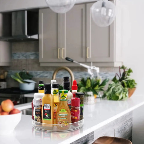 Two Pack 11 Inch Lazy Susan Organizer With Non Slip Turntable holding condiments on kitchen counter