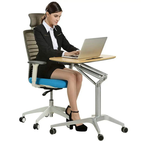 Hassle Free Pneumatic Sit Stand Laptop Desk Cart With Smooth Lever Adjustments Solid Rolling Ergonomic Mobile Workstation And No Fuss Stability For Home Office Study, adjustable height with user sitting.