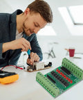 Technician working with 8 Channel Isolation Module For DC 12V 24V Power And Control Signals, PNP NPN Low High Level Output.
