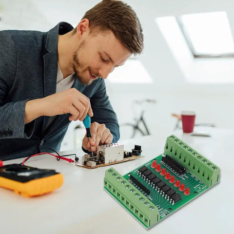 Technician working with 8 Channel Isolation Module For DC 12V 24V Power And Control Signals, PNP NPN Low High Level Output.