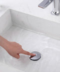 Finger pressing Pop Up Sink Stopper For 1.1 To 1.5 Inch Drains, Stainless Steel Hair Catcher Drain Filter, in white basin