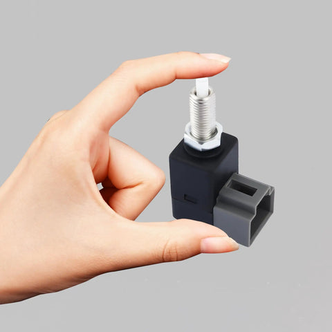 Hand holding Reliable 4 Pin Brake Light Switch Replacement For Hyundai And Kia Cars With Plug And Play OEM Style Fitment CNR1164 938103K000