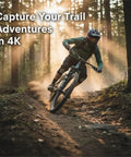 Mountain biker using 4K Bike Camera With GPS Tracking And Integrated Cycling Computer Headlight on forest trail