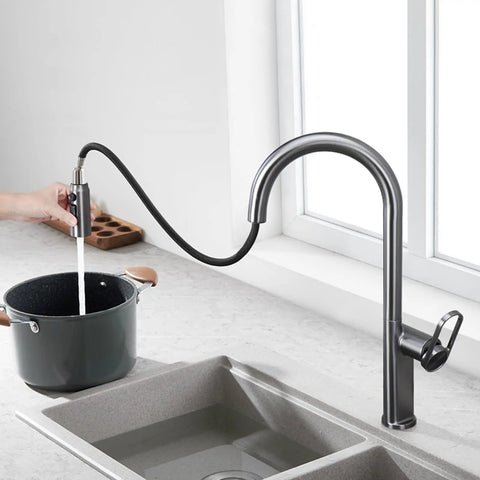 TXGJWRA Green Pull-Faucet with 360-Degree Swivel Spray Head, Single Hole Sink Mixer, Modern Kitchen Tap pouring water into a pot.