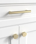 Door And Drawer Pulls 6-Inch Center-To-Center Brushed Titanium Gold Finish 10 Pack installed on white cabinet
