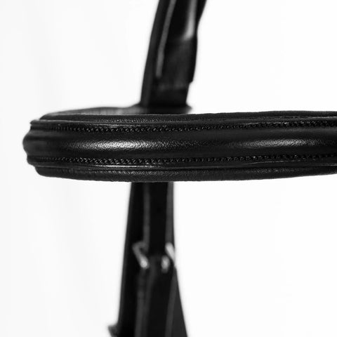Close-up of black padded cavesson on Padded Dressage Bridle With Reins And Removable Flash In Black For Warmbloods All Day Comfort.