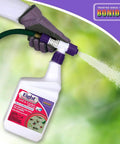 Eight Insect Control Yard And Garden Ready To Spray 32 oz bottle being used on lawn with hose attached