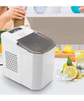 Fast Freeze Countertop Ice Maker Delivering Quick Snap Cubes And No Fuss Automatic Cooling With Portable Compact Design in kitchen setting.