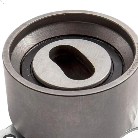 Thinking Process: metal timing belt tensioner pulley, close-up front view for Honda Integra engine maintenance