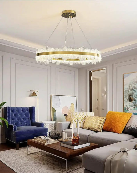 Chic Round Gold LED Pendant Light With Cut Diamond Glass Shade Dimmable Hanging Lamp For Modern Spaces, large circular design in cozy living room.